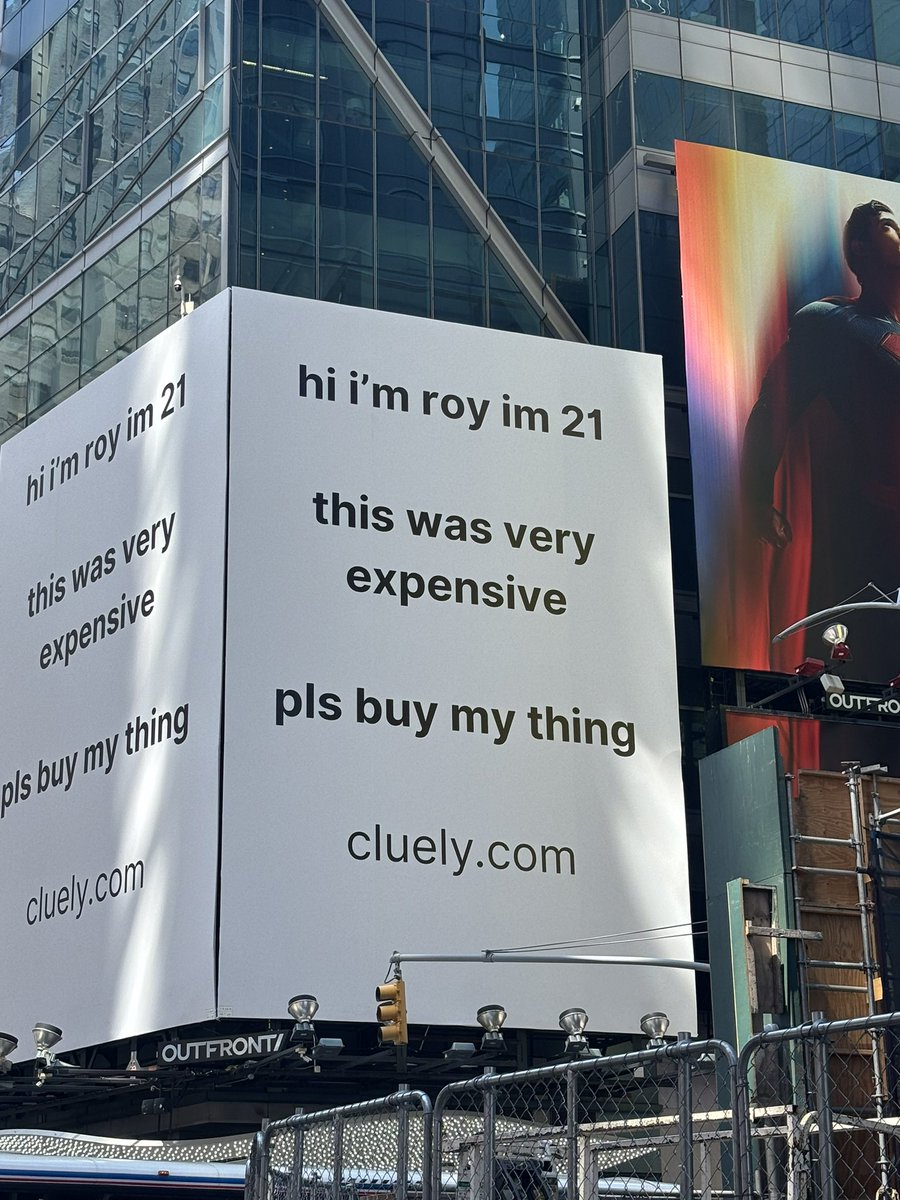 Cluely Times Square billboard: 'hi i'm roy im 21, this was very expensive, pls buy my thing, cluely.com'